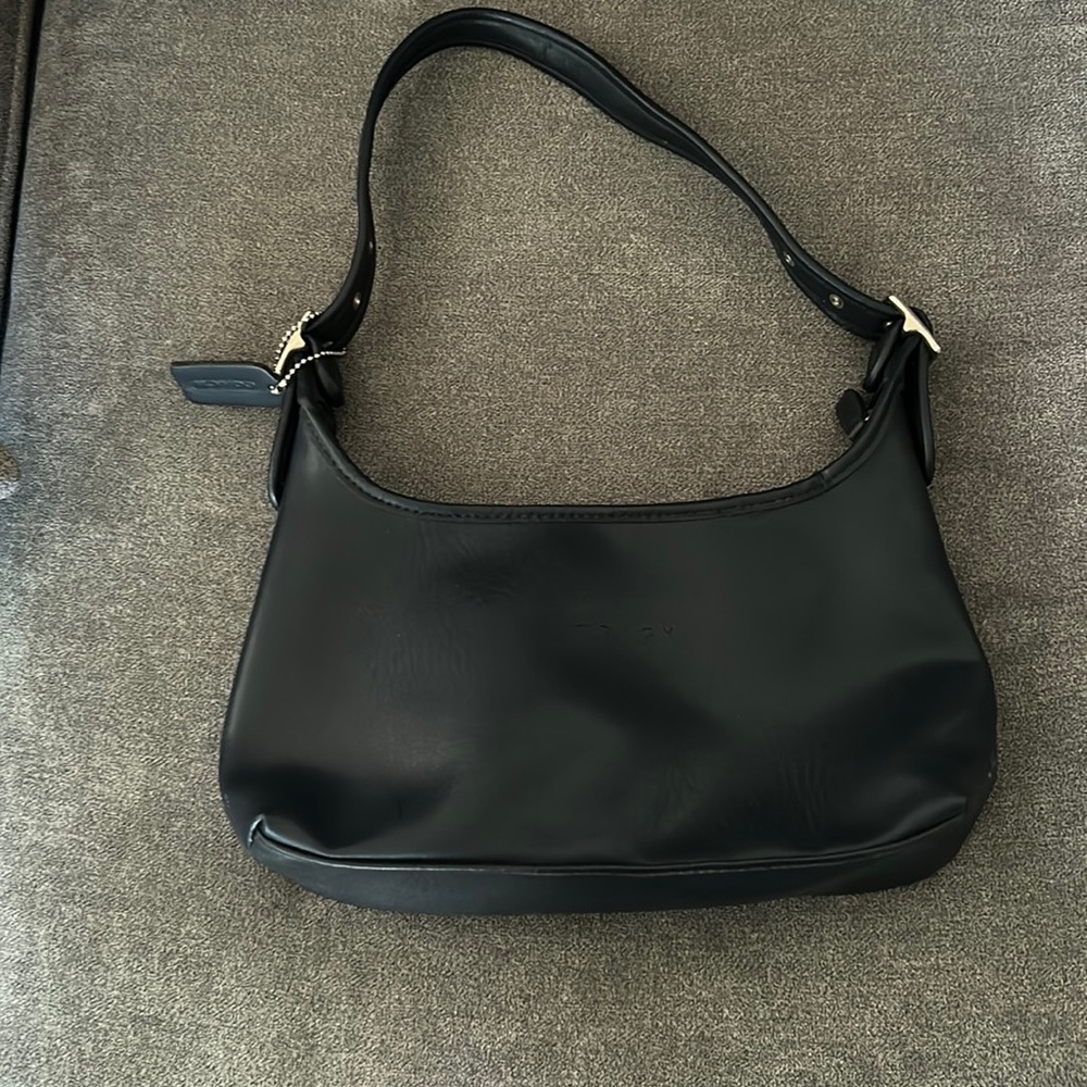 A fairly new coach bag that has seen little use could be a nice addition for u